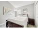 Cozy bedroom with a comfortable bed, accent lighting, and neutral decor at 1517 Little Brook Ln, Brandon, FL 33511