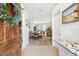 Inviting foyer with decorative elements leading into a dining area with hardwood flooring and sunlit living spaces at 1517 Little Brook Ln, Brandon, FL 33511