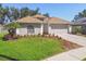 Charming single-story home with a well-manicured lawn and fresh landscaping at 1517 Little Brook Ln, Brandon, FL 33511
