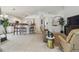 Open-concept kitchen and living room with neutral colors, bar-top counters, and lots of natural light at 1517 Little Brook Ln, Brandon, FL 33511