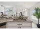 Well-lit kitchen featuring granite countertops and stainless steel appliances at 1517 Little Brook Ln, Brandon, FL 33511