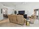 Comfortable living room with reclining furniture, tile flooring, and open floor plan at 1517 Little Brook Ln, Brandon, FL 33511