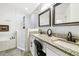 Modern main bathroom featuring a double sink vanity, granite countertops, and walk-in shower at 1517 Little Brook Ln, Brandon, FL 33511