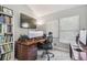 Well-lit home office featuring a large desk and ample storage for books and supplies at 1517 Little Brook Ln, Brandon, FL 33511