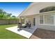 Relaxing outdoor patio with seating area, perfect for entertaining or enjoying quiet moments at 1517 Little Brook Ln, Brandon, FL 33511