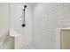 Modern shower featuring subway tile and rainfall shower head at 1517 Little Brook Ln, Brandon, FL 33511
