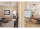 Open bedroom view with decorative lighting and adjacent bathroom at 1816 Curry Rd, Lutz, FL 33549