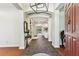 Elegant foyer with tile flooring, leading to the living room and other living spaces at 1816 Curry Rd, Lutz, FL 33549