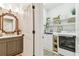 Laundry room with sink, shelving, washer, and dryer at 1816 Curry Rd, Lutz, FL 33549