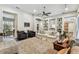 Spacious living room with built-in shelving, comfortable seating, and a view of other rooms at 1816 Curry Rd, Lutz, FL 33549