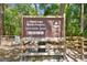 Sign for Violet Cury Nature Preserve at 1802 Sinclair Hills Rd with hours from sunrise to sunset and activities at 1816 Curry Rd, Lutz, FL 33549