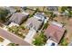 Aerial view of a single-Gathering home, showcasing the property's layout, screened-in pool, landscaping, and neighborhood at 221 Lakeway Ln, Apollo Beach, FL 33572