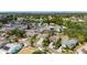 High aerial view of a residential area with a variety of homes, green spaces, and the targeted property in the center at 221 Lakeway Ln, Apollo Beach, FL 33572