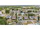 Scenic aerial view of a home highlighting its screened pool, well-maintained yard, and peaceful residential setting at 221 Lakeway Ln, Apollo Beach, FL 33572