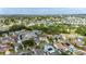 From above, see the beauty of the community, with serene lakes, mature landscaping, and this home nestled in the heart of it all at 221 Lakeway Ln, Apollo Beach, FL 33572
