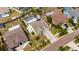 Aerial view capturing the layout of the home, its screened pool, backyard landscaping, and proximity to other properties at 221 Lakeway Ln, Apollo Beach, FL 33572