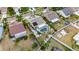 Aerial view of a property featuring a pool, lanai, and well-maintained landscaping at 221 Lakeway Ln, Apollo Beach, FL 33572