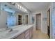 Bathroom featuring a double sink vanity and shower/tub combo at 221 Lakeway Ln, Apollo Beach, FL 33572