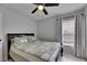 This bedroom boasts neutral walls, tile flooring, and a ceiling fan at 221 Lakeway Ln, Apollo Beach, FL 33572