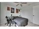 This cozy bedroom features fun decor, neutral walls, and a ceiling fan at 221 Lakeway Ln, Apollo Beach, FL 33572