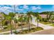 Charming one-story home with a well-manicured lawn, lovely landscaping, and a driveway leading to an attached garage at 221 Lakeway Ln, Apollo Beach, FL 33572