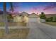 Charming one-story home featuring a well-manicured lawn, palm trees and a two-car garage at 221 Lakeway Ln, Apollo Beach, FL 33572