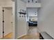 This hallway leads to the living area and bedrooms, featuring tile flooring at 221 Lakeway Ln, Apollo Beach, FL 33572