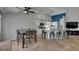 Open kitchen features white cabinets, a center island with bar seating, and stainless steel appliances at 221 Lakeway Ln, Apollo Beach, FL 33572