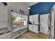 Bright kitchen nook with a large window and a stainless steel refrigerator at 221 Lakeway Ln, Apollo Beach, FL 33572