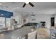 The large open-concept living area features tile flooring, recessed lights, and ceiling fans at 221 Lakeway Ln, Apollo Beach, FL 33572