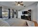 Bright bedroom features three windows, a ceiling fan, and dark curtains at 221 Lakeway Ln, Apollo Beach, FL 33572