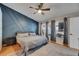 Bedroom featuring three windows, a ceiling fan, and hardwood floors at 221 Lakeway Ln, Apollo Beach, FL 33572