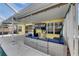 Outdoor patio featuring comfortable seating, entertainment area, and backyard access at 221 Lakeway Ln, Apollo Beach, FL 33572