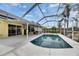 Backyard pool area with screened-in enclosure offers outdoor dining and lounging at 221 Lakeway Ln, Apollo Beach, FL 33572