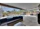 Screened-in pool area offers comfortable seating, lush landscaping, and a relaxing atmosphere at 221 Lakeway Ln, Apollo Beach, FL 33572