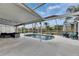 Inviting screened-in pool featuring outdoor seating, and a peaceful backyard retreat at 221 Lakeway Ln, Apollo Beach, FL 33572