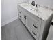 Bathroom vanity with marble countertop, stylish black hardware and tiled floors at 2528 Columbus S Way, St Petersburg, FL 33712