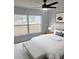 Serene bedroom featuring a comfortable bed, bench, and bright window at 2528 Columbus S Way, St Petersburg, FL 33712