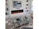 Sleek living room with a modern fireplace and stylish bookshelves at 2528 Columbus S Way, St Petersburg, FL 33712