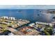 Scenic aerial view of waterfront homes with private docks, a pool, and easy access to the bay at 2600 N Paula Dr # 2B, Dunedin, FL 34698