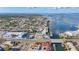 Panoramic aerial view showcases the community's waterfront location, pools, and convenient amenities at 2600 N Paula Dr # 2B, Dunedin, FL 34698