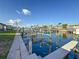 Scenic waterfront view showcasing the property's community boat slips with power lines above at 2600 N Paula Dr # 2B, Dunedin, FL 34698