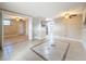 Spacious living room with tile floors, ceiling fan, neutral paint and versatile open layout at 2600 N Paula Dr # 2B, Dunedin, FL 34698