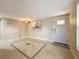 Bright living room with tile floors, ceiling fan, and a front door entrance at 2600 N Paula Dr # 2B, Dunedin, FL 34698