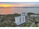 Stunning aerial view of the condominium building and surrounding ocean at sunset at 2625 Terra Ceia Bay Blvd # 406, Palmetto, FL 34221