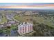 Aerial view of the building surrounded by scenic neighborhood, green space, and ponds at 2625 Terra Ceia Bay Blvd # 406, Palmetto, FL 34221