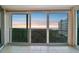 Balcony view with sliding glass doors showcasing waterfront scenery and natural sunlight at sunset at 2625 Terra Ceia Bay Blvd # 406, Palmetto, FL 34221