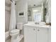 Bathroom featuring a white vanity, toilet, and shower with a white shower curtain at 2625 Terra Ceia Bay Blvd # 406, Palmetto, FL 34221