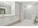 Bright bathroom features dual sinks, vanity, a large mirror, tile flooring, and walk-in shower at 2625 Terra Ceia Bay Blvd # 406, Palmetto, FL 34221