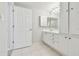 Bathroom features dual sinks, a large vanity, tile flooring, and a large mirror at 2625 Terra Ceia Bay Blvd # 406, Palmetto, FL 34221